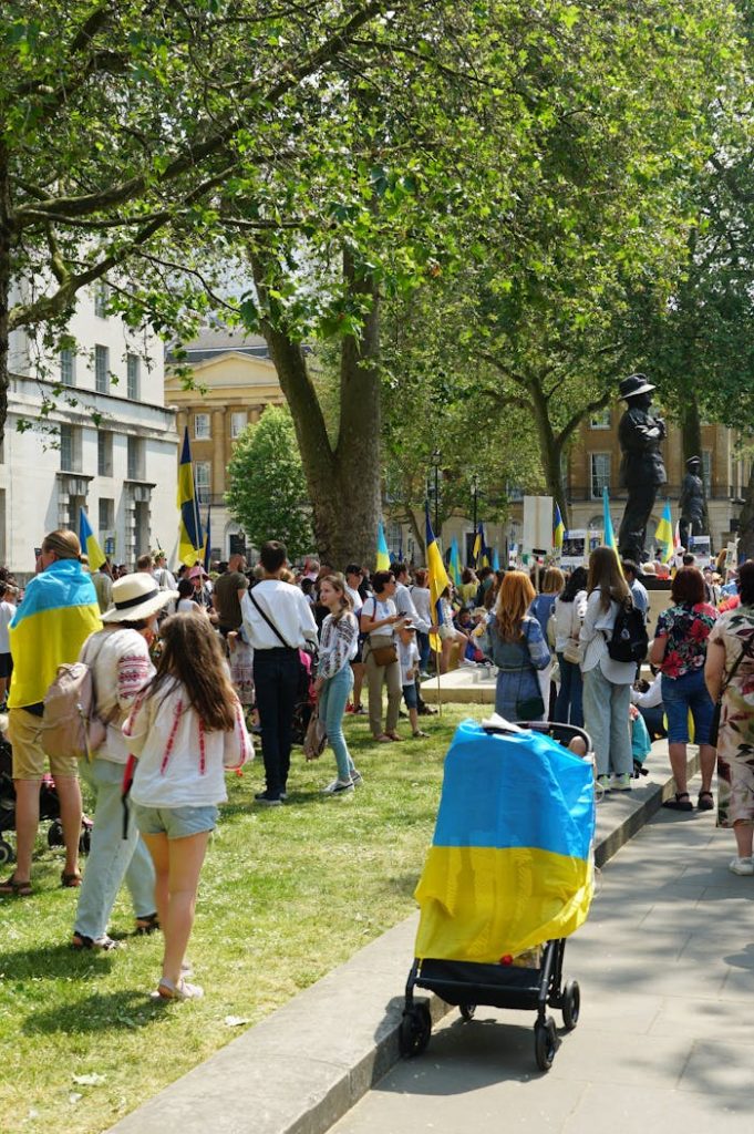 demonstrators-with-ukrainian-flags-in-by-the-ministry-of-defense-building-in-london-17217620 A lively London protest in support of Ukraine, with flags and diverse participants.